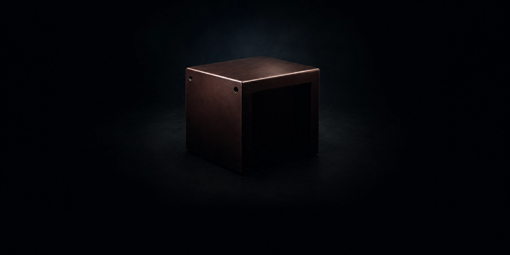Polished wooden enclosure with an even satin sheen on a dark background