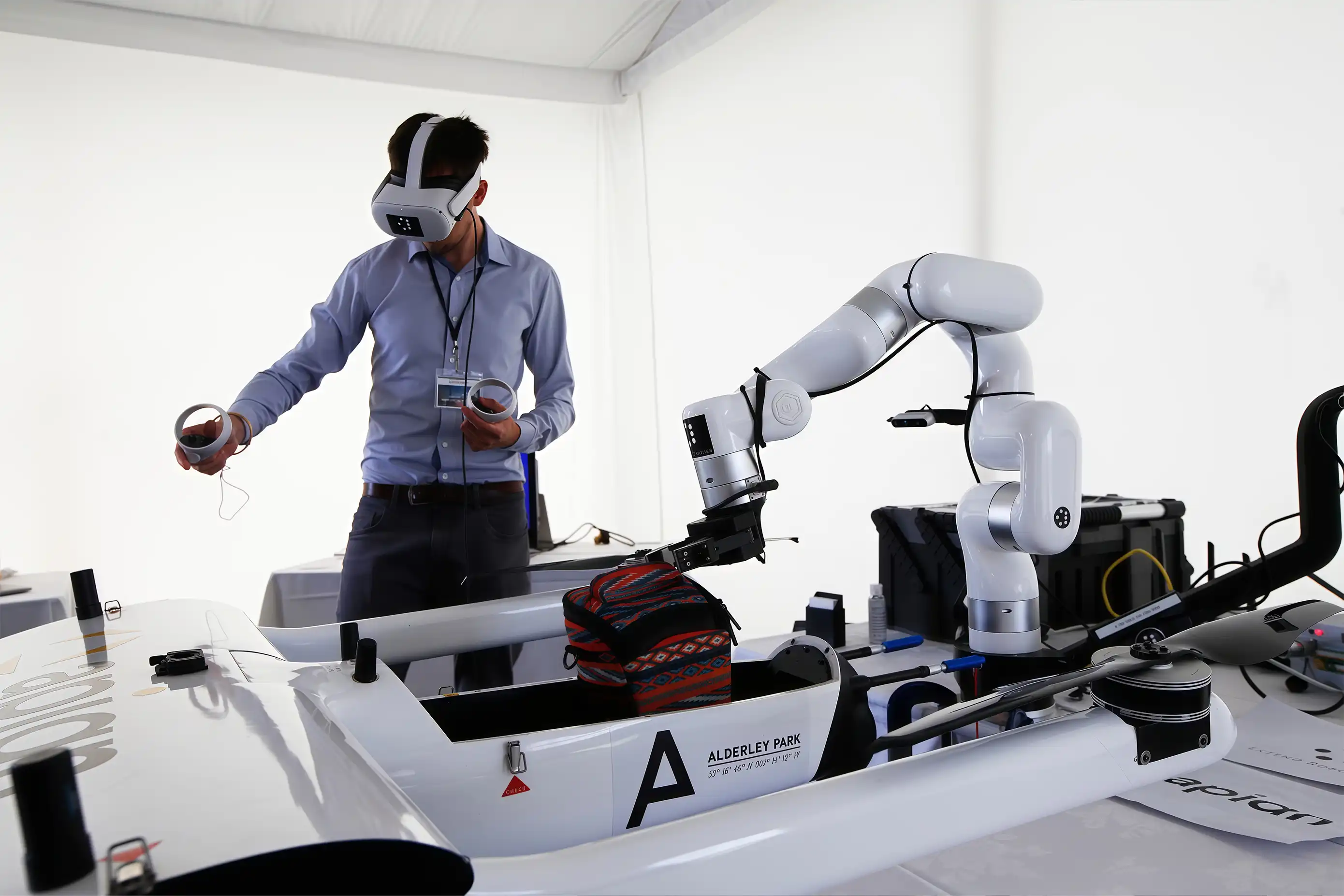 Operator uses VR controllers to remotely guide a UFACTORY xArm