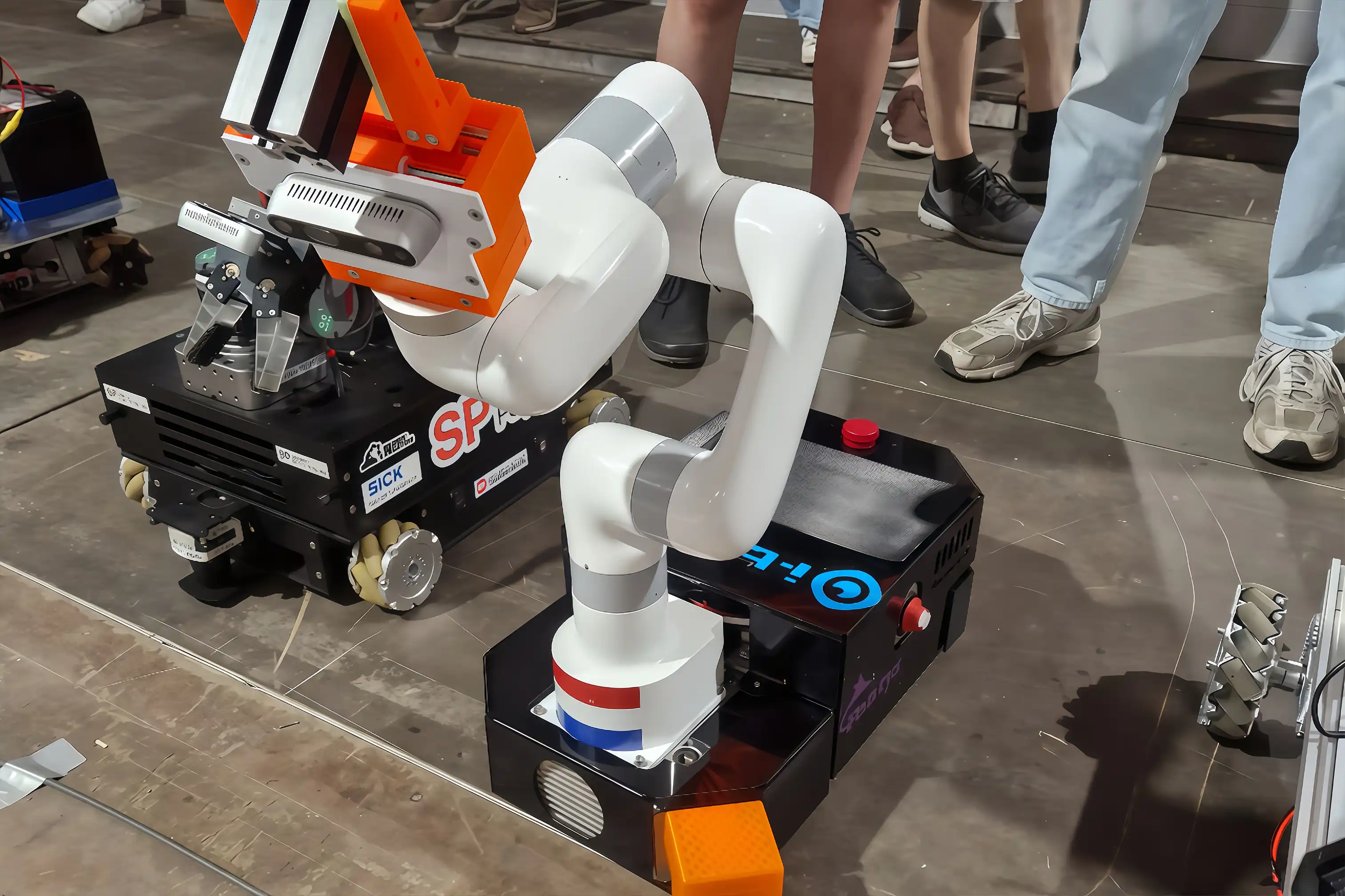 UFACTORY Lite 6 robotic arm equipped with a custom gripper and depth camera mounted on a mobile robot platform