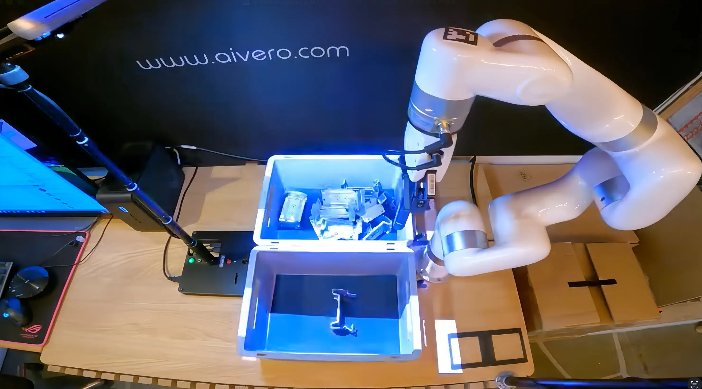 xArm 6 positions its gripper above randomly oriented metal parts for 3D vision-guided bin picking