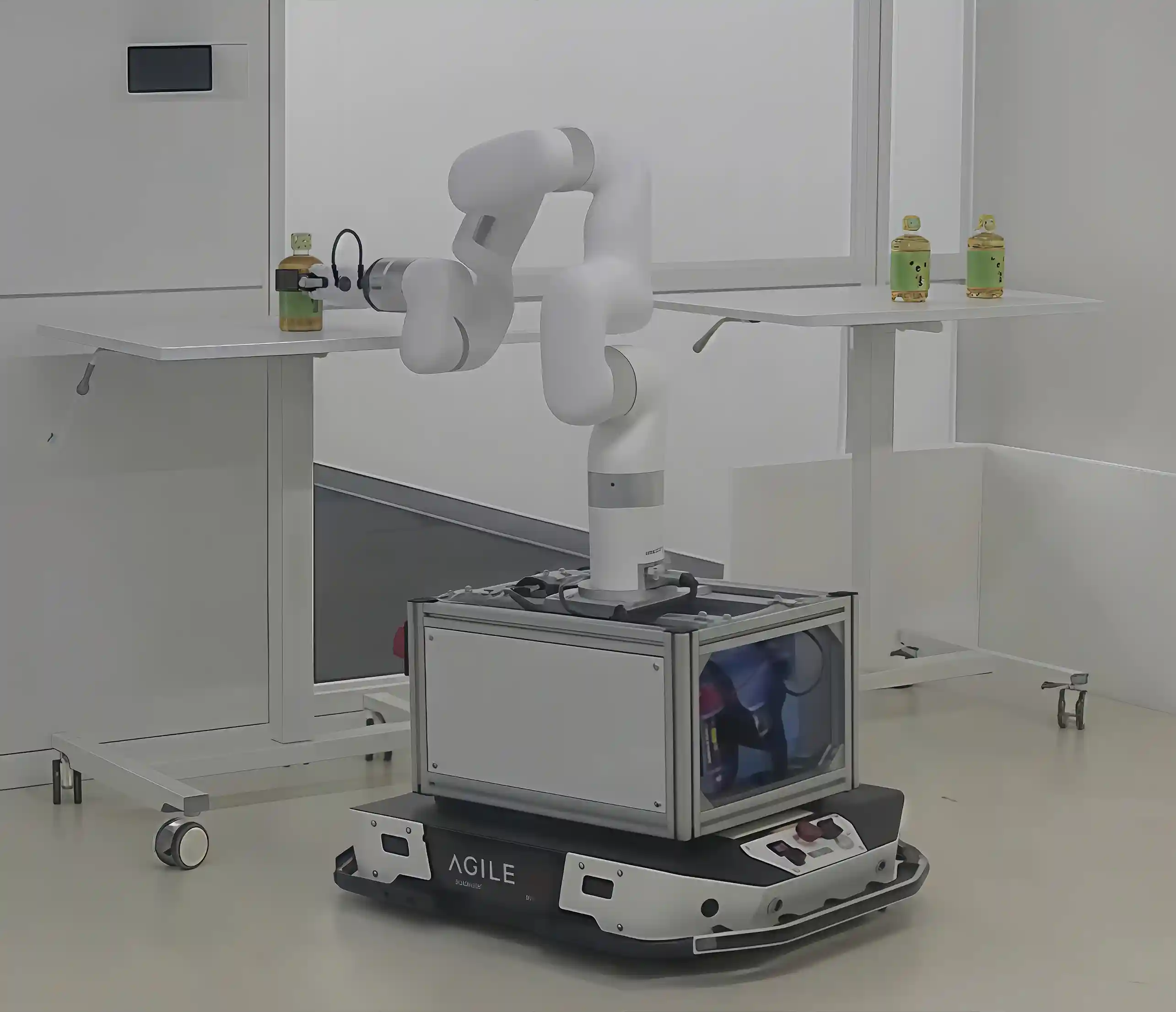  xArm mounted on a mobile robot platform picking up and transporting a bottle